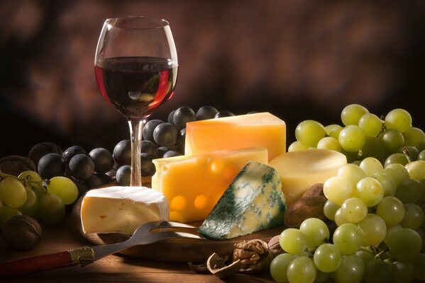 Red wine and grapes with cheese and nuts