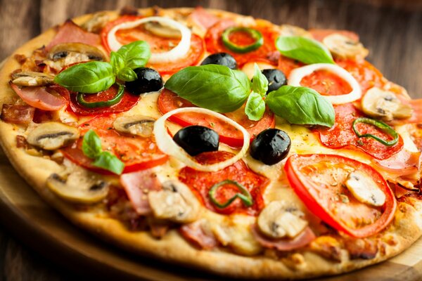 Pizza with ham and mushrooms, olives are included