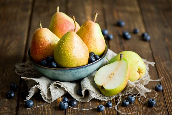 Still life with pears in a bowl and blueberries