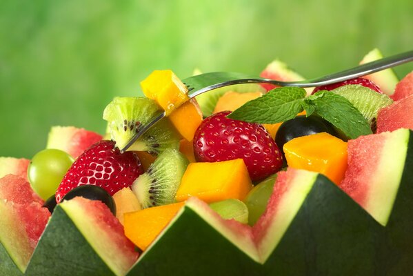 Fruit salad embedded in a sliced watermelon