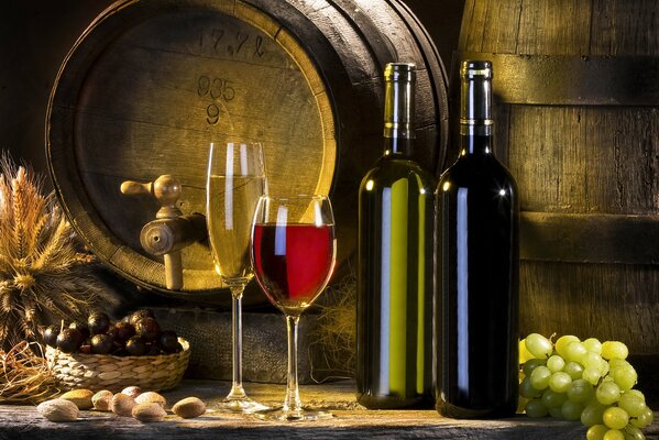 Bottles of red and white wine with glasses