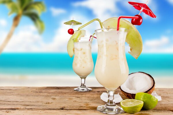 Cocktails with fruit and strawberries on a blue background