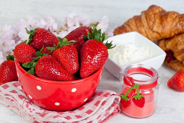 Strawberries in a red bowl with polka dots