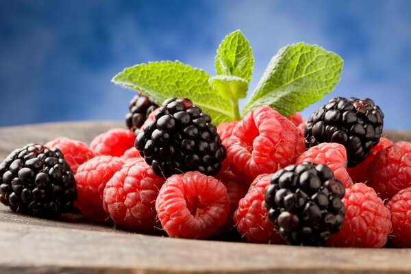 Still life of raspberries and blackberries on a platter