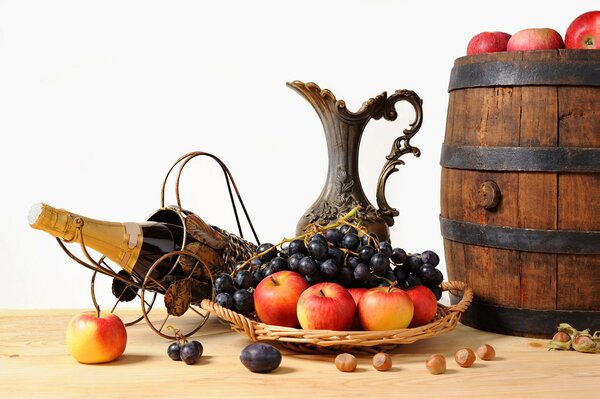 Wine on a stand and a barrel with apples