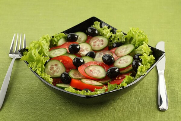 Awesome food of tomatoes and cucumbers on a plate