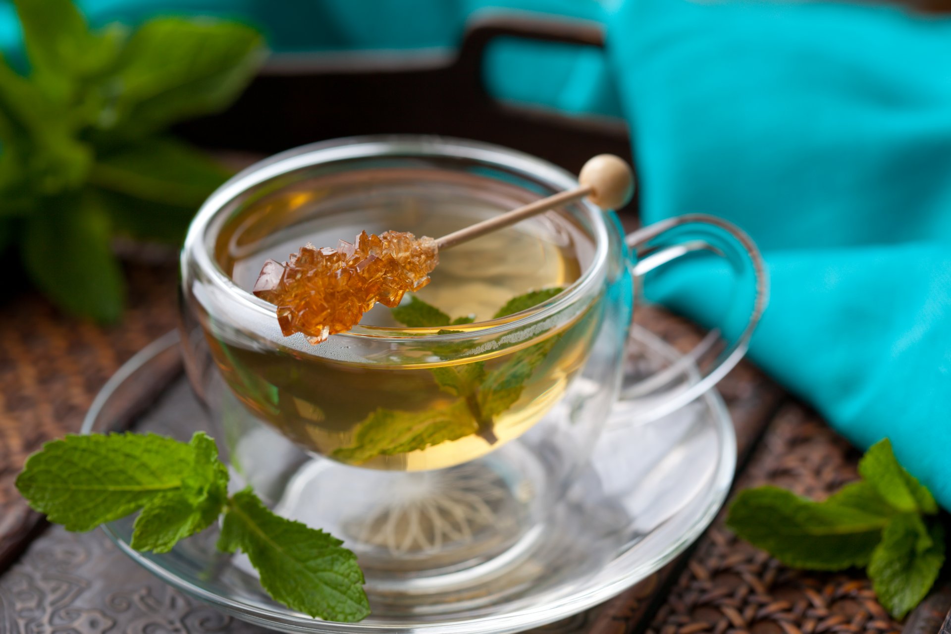 cup tea sticks sugar mint