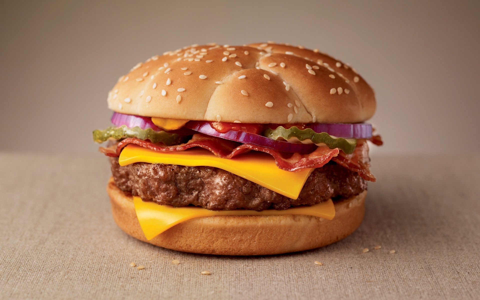 food fast food cheeseburger bacon patty sauce ketchup cheese cucumber torment roll sesame
