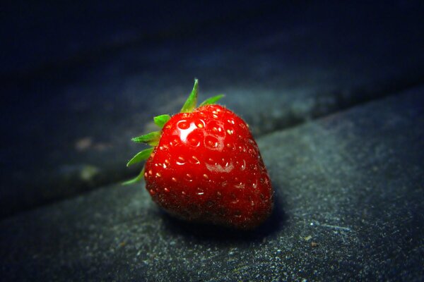 Red strawberries on a black background