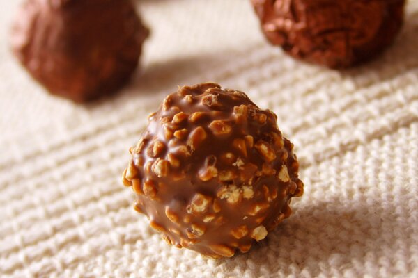 Round chocolate candies with nuts