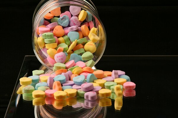 A jar of crumbled multicolored dragees