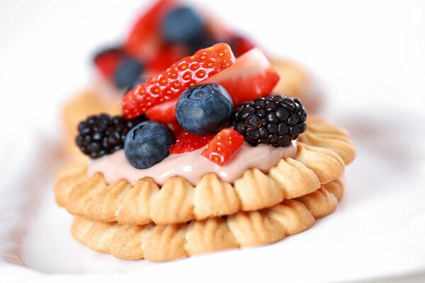 Delicious pastries with berry decoration