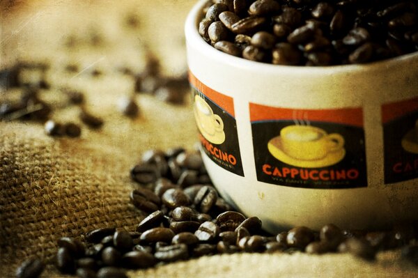 Black coffee beans in a cup