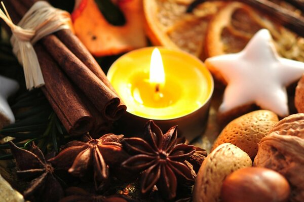 Candles and spices in the New Year decor