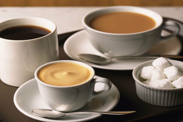 Different cups of coffee with sugar