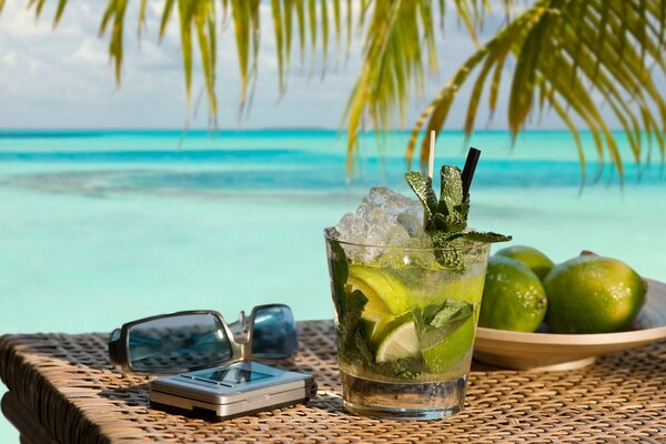 Mojito cocktail on the background of the ocean