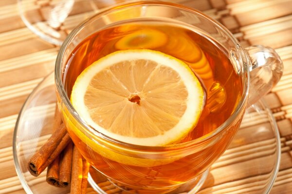 A cup of tea with lemon and cinnamon