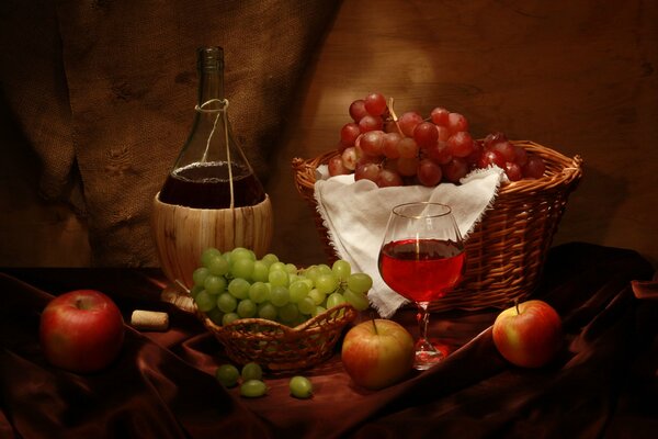 Still life with a beautiful bottle, grapes and a glass of wine