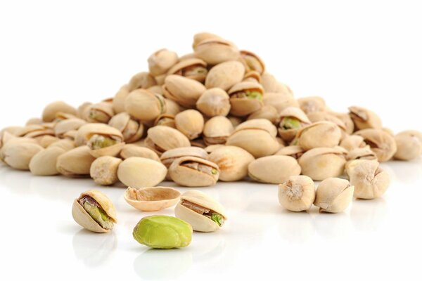 Green pistachio nuts in a shell