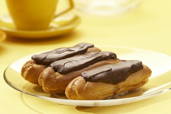 Eclairs with chocolate for tea dessert is delicious