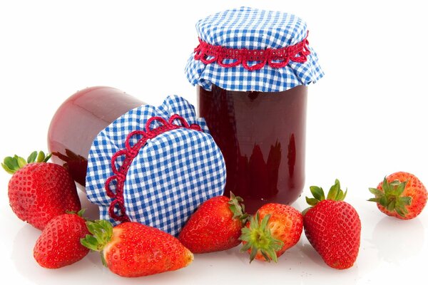 Jars of berry jam background white