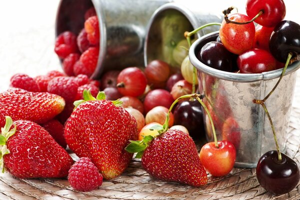 Summer berries in a metal cup