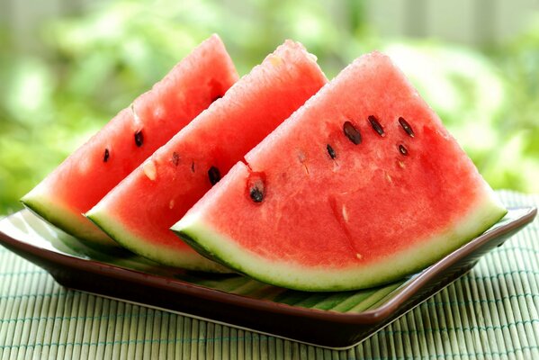 A flying slice of watermelon on a plate