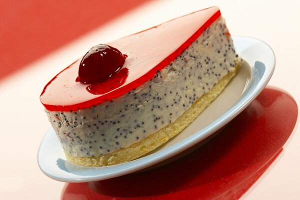 A piece of cake with cherry jelly