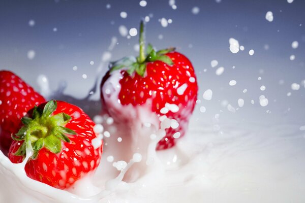 Strawberry sprinkles in cream in slow motion