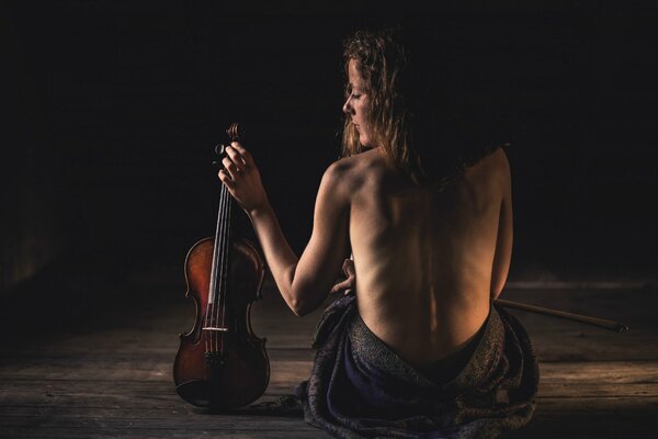 Naked girl with a violin