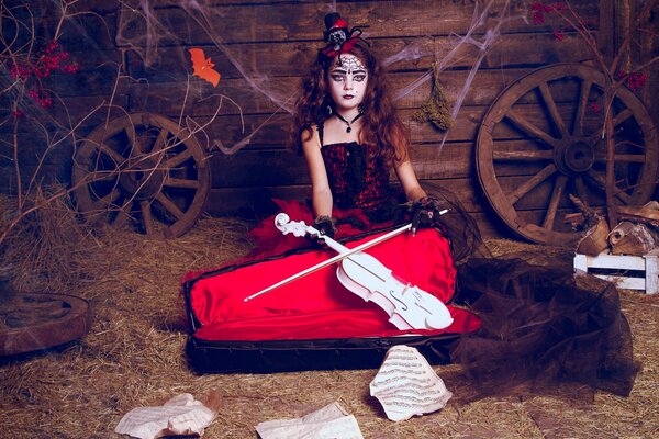 A girl with a white violin on a rustic background