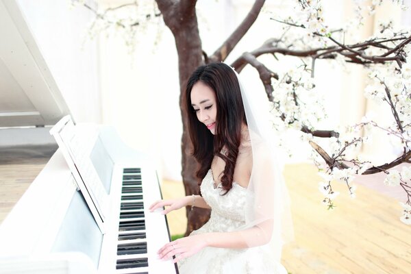 The bride playing the piano