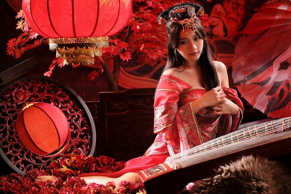 Stylish oriental girl with a musical instrument