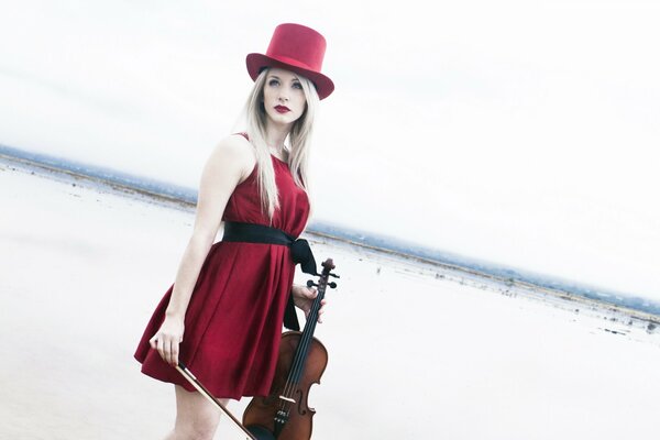 A woman in red with a violin