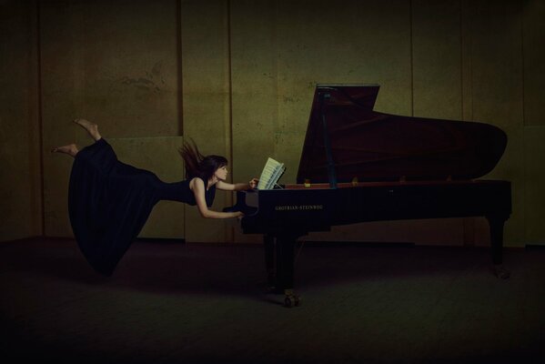 A girl in a black dress escapes from the piano