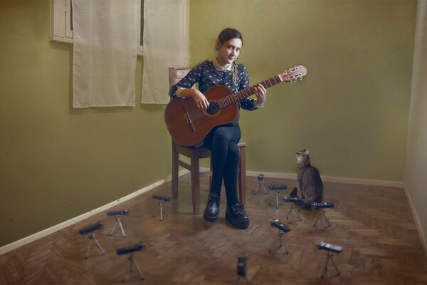 Music for a cat from a girl with a guitar