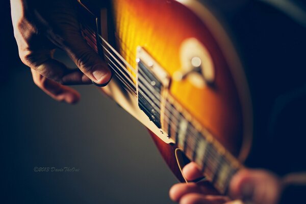 Close-up images of a man with a guitar