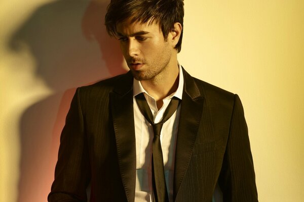 Singer Enrique Iglesias with a slight unshaven face in a jacket