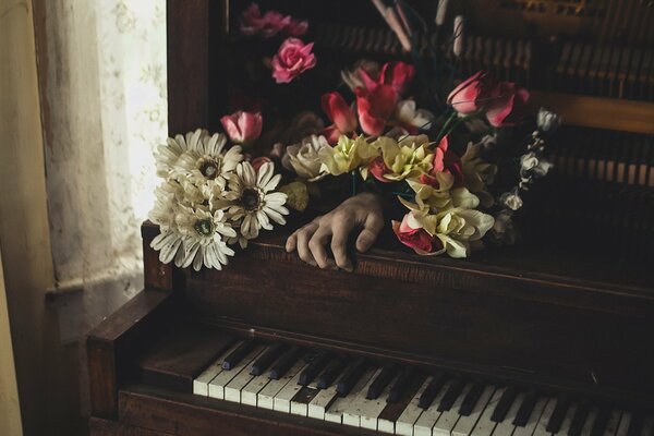 An invisible hand is playing music on a forgotten piano