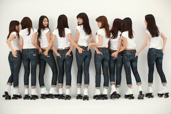 Korean girls in jeans and roller skates