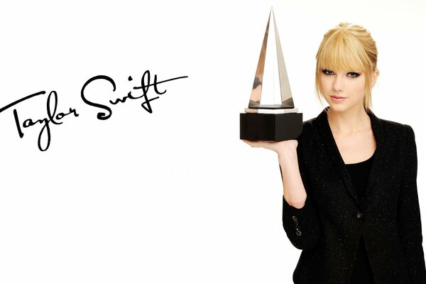 Blonde girl holds an award