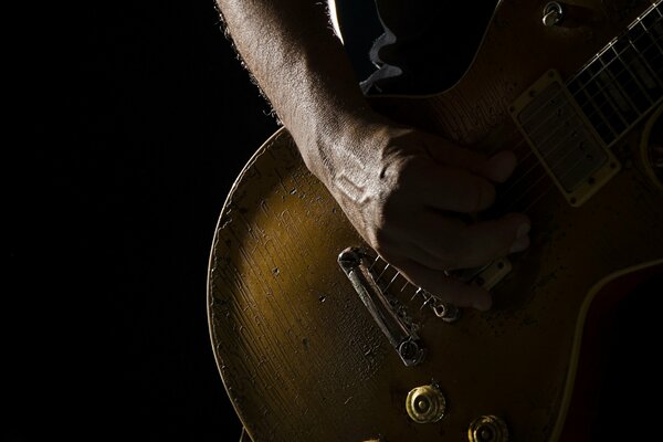 Macro photo of a guitar on a black background