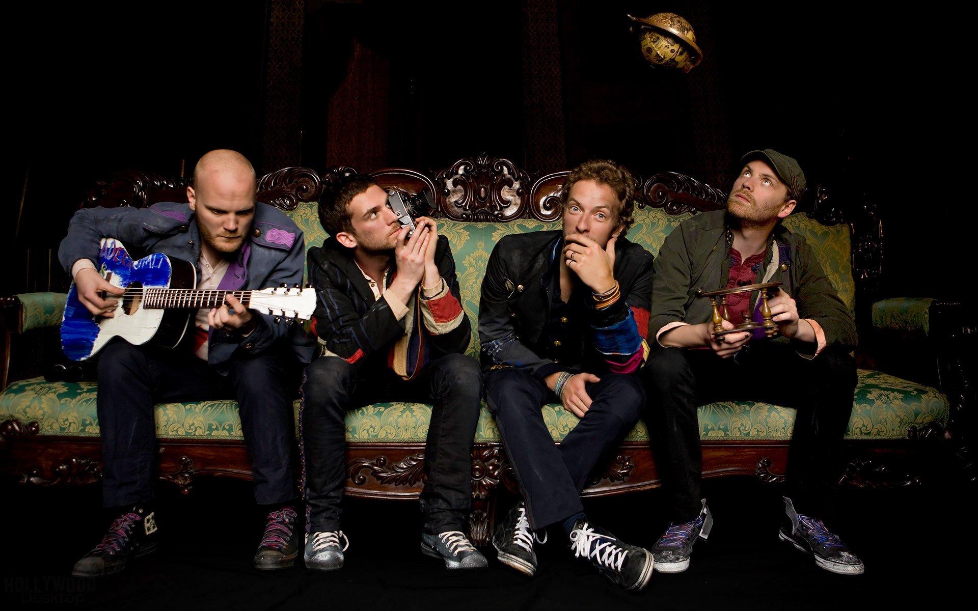 the group guitars coldplay chris martin sofa jonny buckland guy berryman will champion