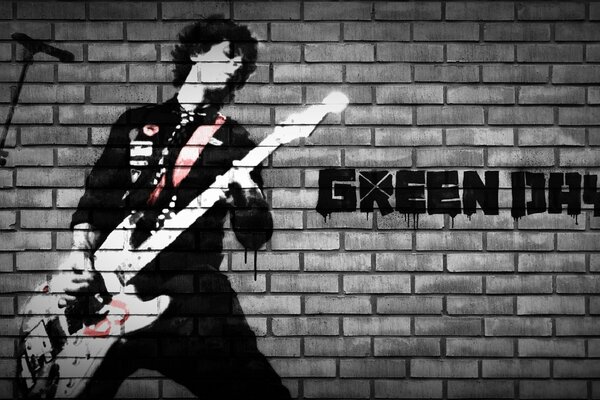 Vocalista de la banda Green Day con guitarra