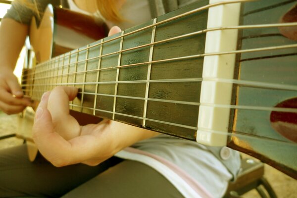 Music guitarist with guitar macro in light colors