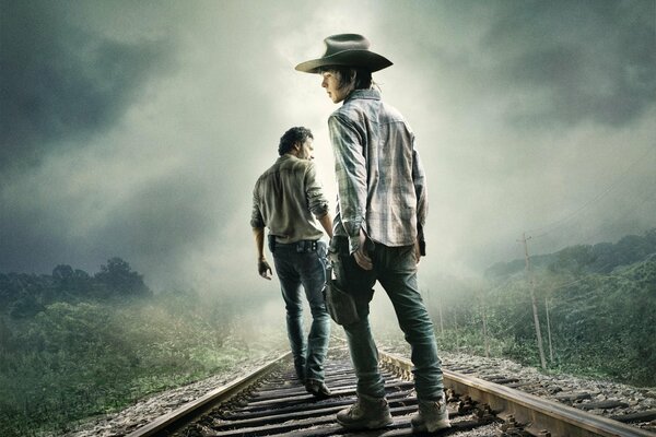 Los chicos de la serie the Walking Dead en el ferrocarril