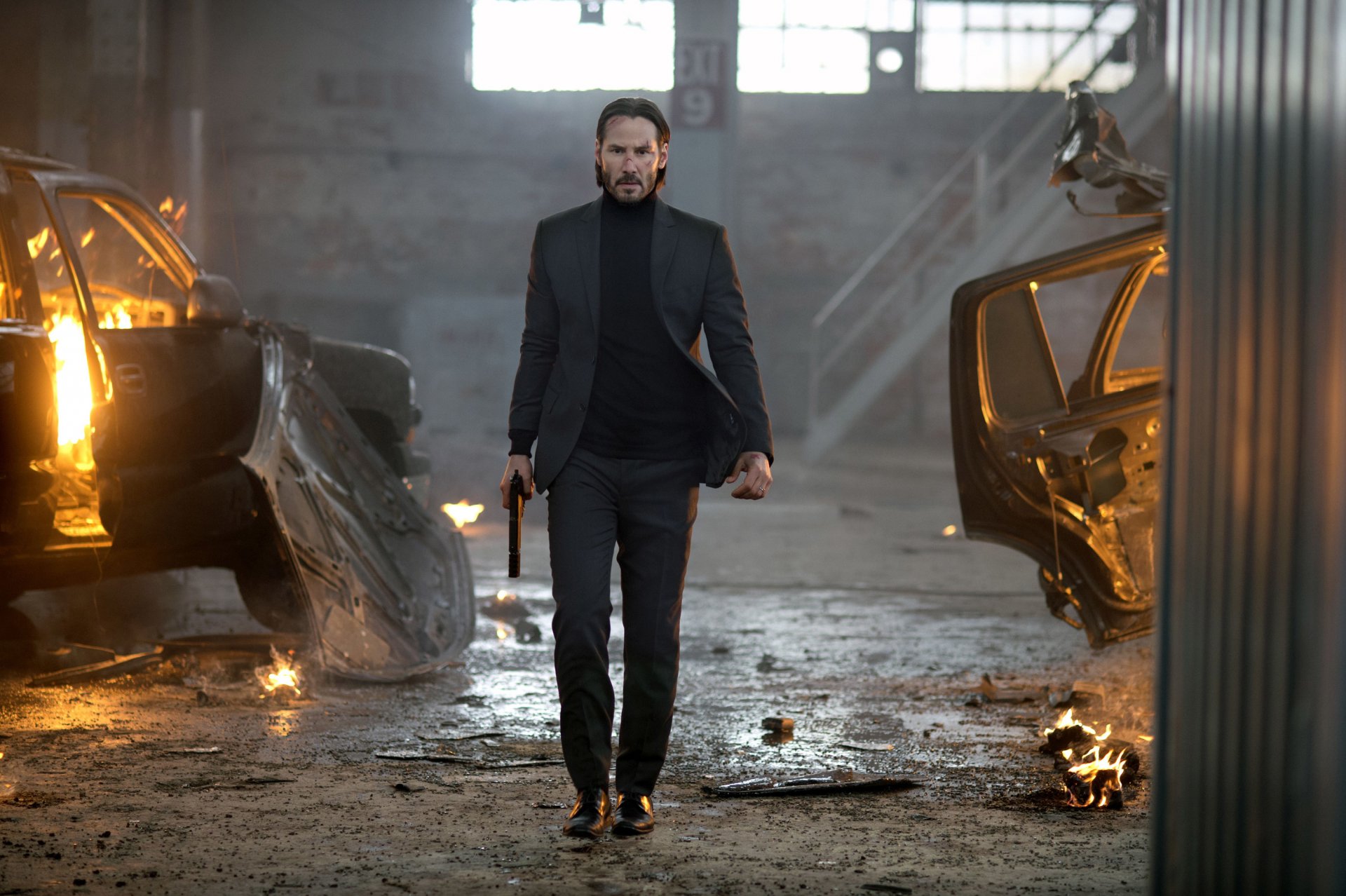 john wick keanu reeves tuta pistola