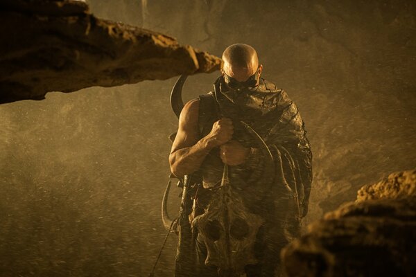 Vin Diesel in dark glasses as Riddick