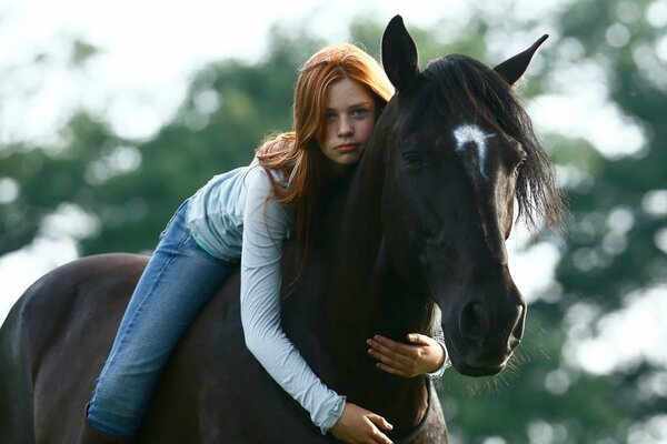 Beautiful girl riding a horse