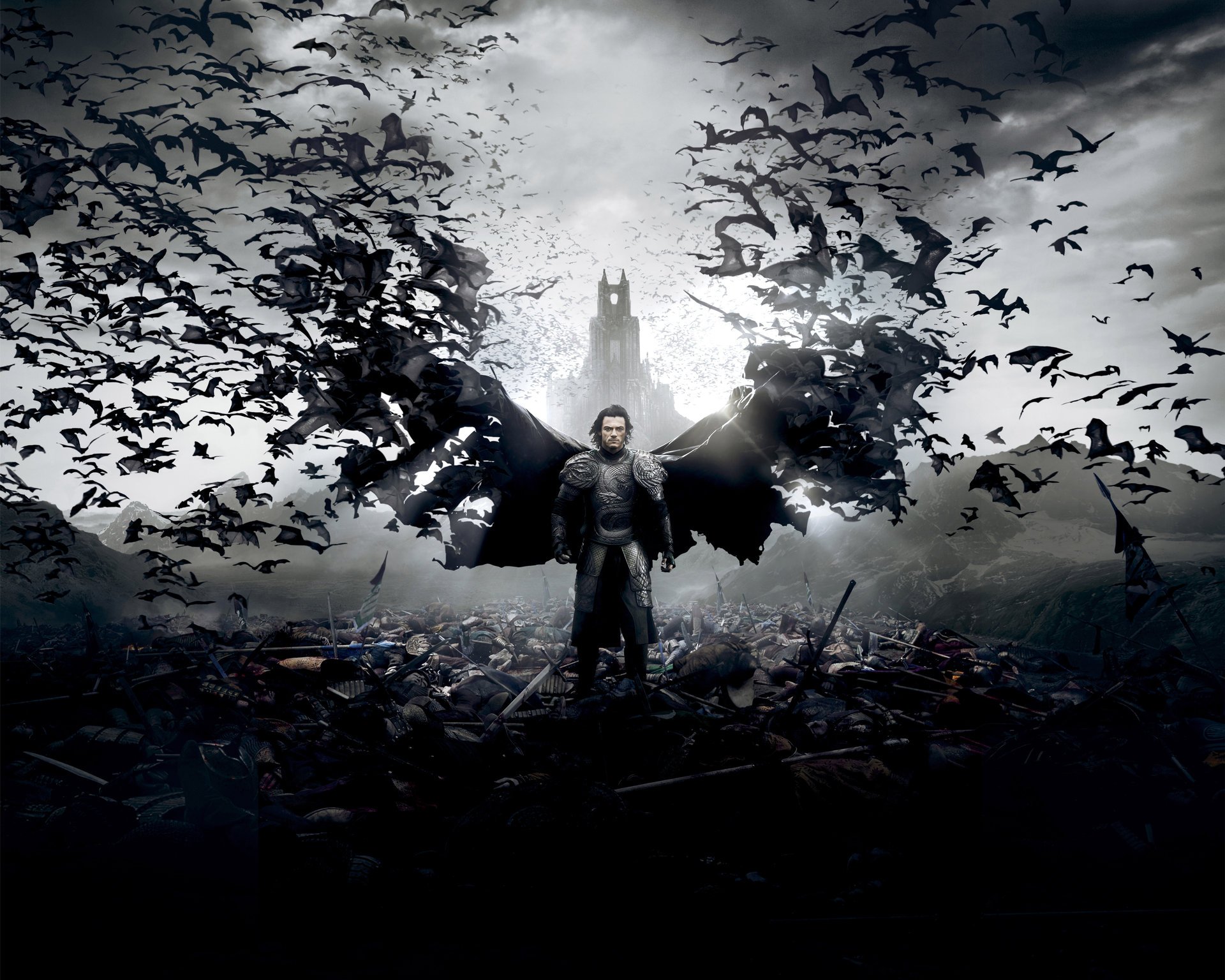 dracula untold dracula untold film film 2014 luke evans comte vlad tepes action drame fantastique horreur photos légendaires universal pictures homme vampire armure épée arme chauves-souris cape ailes champ de bataille morts cadavres château palais ciel nuages